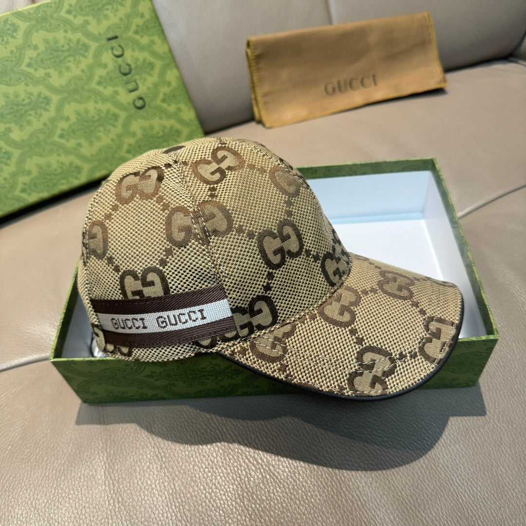 Beige Gucci monogram baseball cap with front logo web band and curved brim.