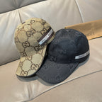 Pair of caps: black and beige Gucci monogram baseball caps with logo bands