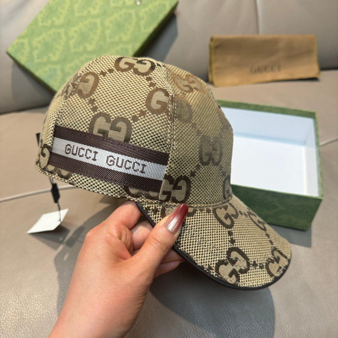 Beige Gucci monogram baseball cap with front web logo band and curved brim.