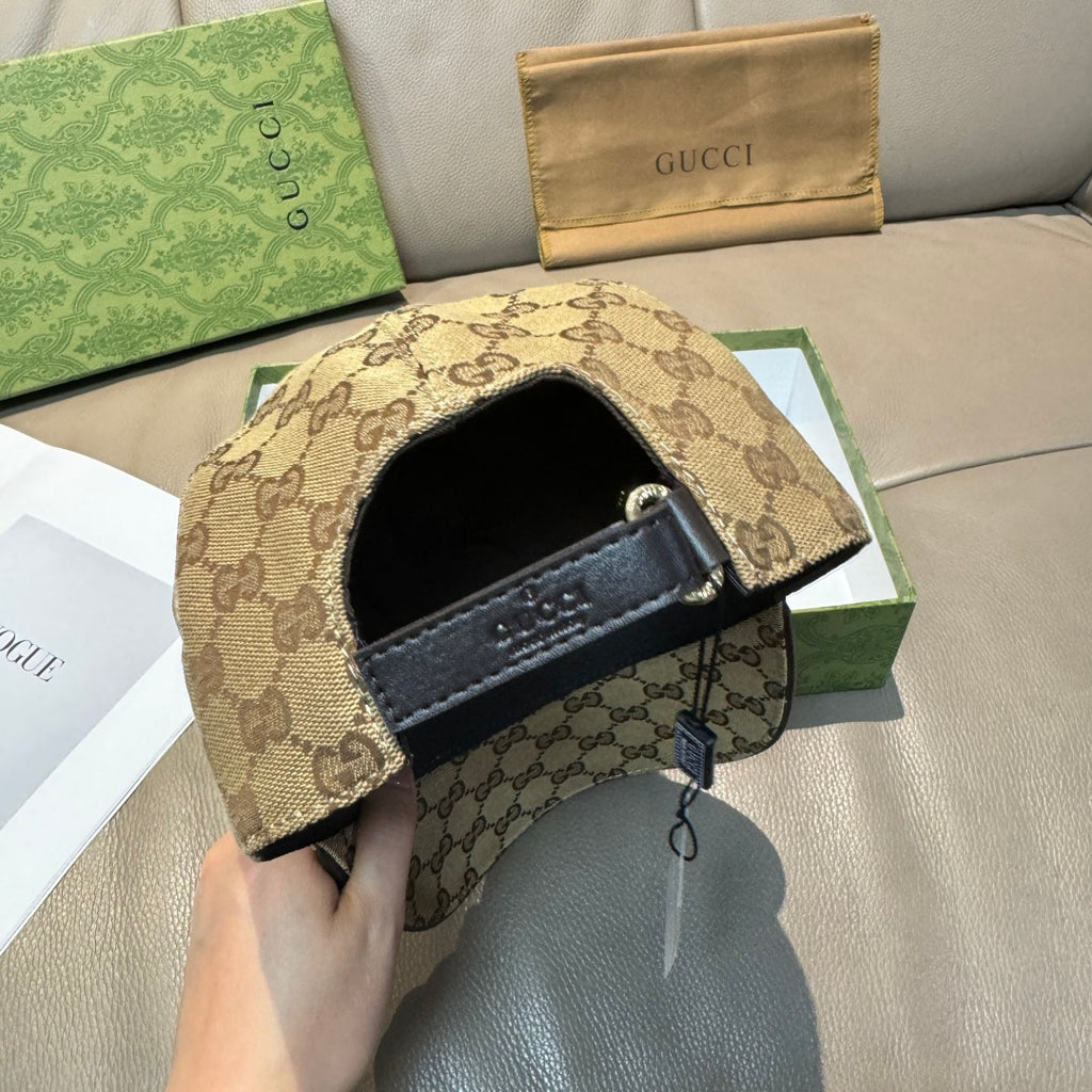 Gucci GG monogram cap showing inner strap buckle and tag