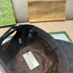 Black Gucci cap interior with fabric strap and small hanging label