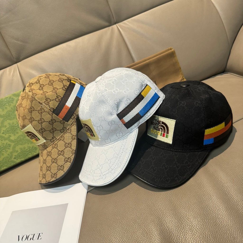 Set of three Gucci logo caps: beige, white, and black with multicolor stripes