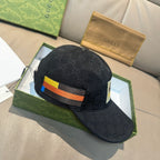 Black Gucci cap with multicolor stripe and textured monogram pattern