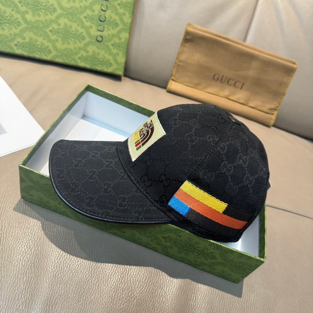 Black Gucci cap with multicolor stripe detail across the side and curved brim