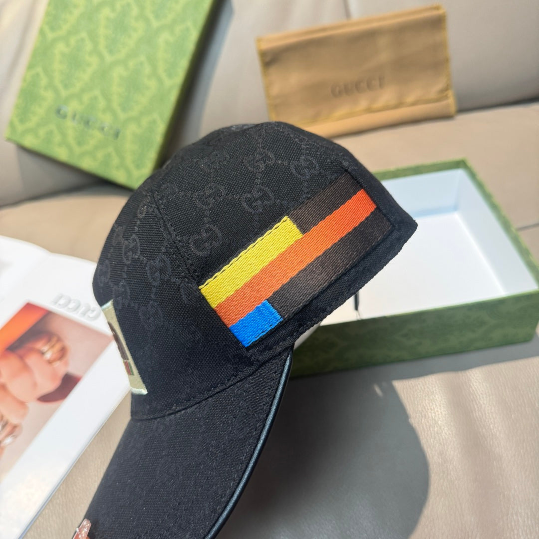 Black Gucci cap with multicolor stripe on the side and dark monogram pattern