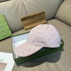 Light pink Gucci GG baseball cap, side view with curved brim and top button