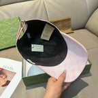 Light pink Gucci GG baseball cap with interior facing up, black lining visible