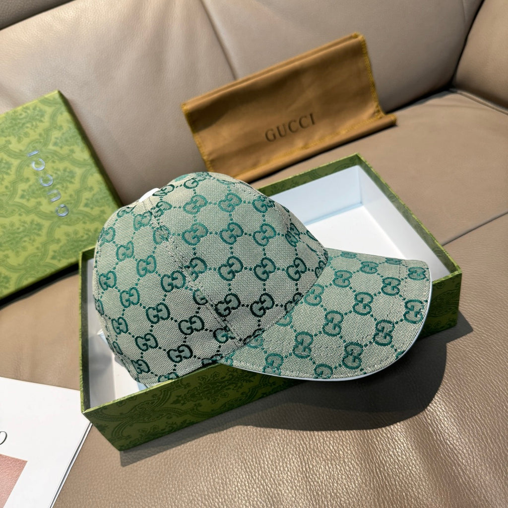 Gucci GG monogram baseball cap, teal fabric, curved brim, side profile.