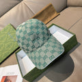 Gucci cap in teal GG monogram canvas, curved brim, adjustable strap at back.