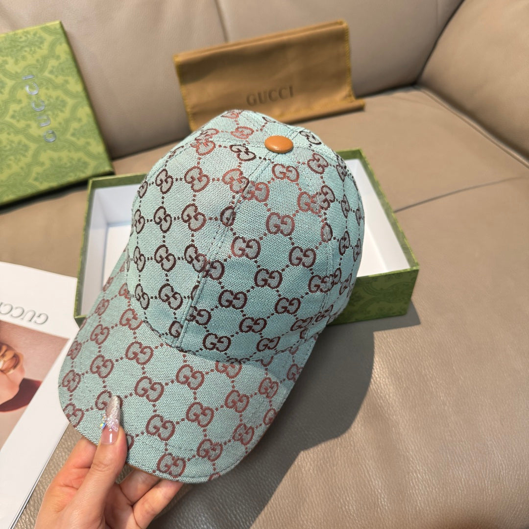 Gucci cap in light blue GG monogram with orange button and curved brim