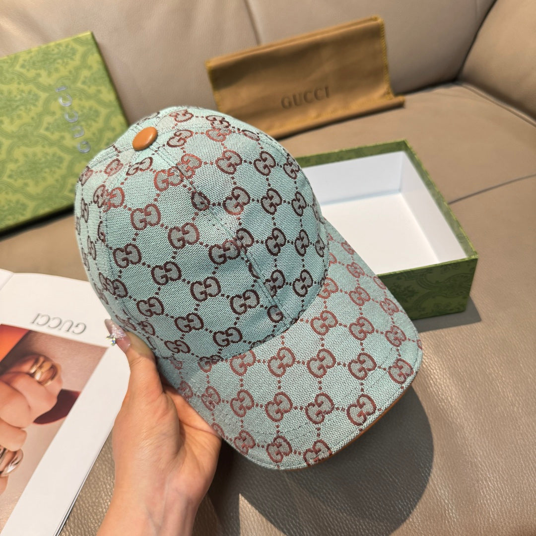 Gucci cap in light blue GG monogram with tan leather-like button on top
