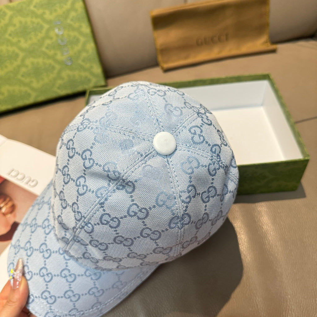 Gucci light blue monogram baseball cap top view with small snap button