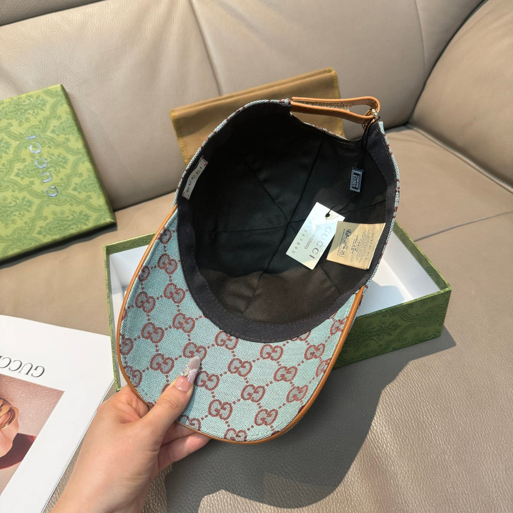 Gucci cap with light blue GG monogram fabric and black inner panel