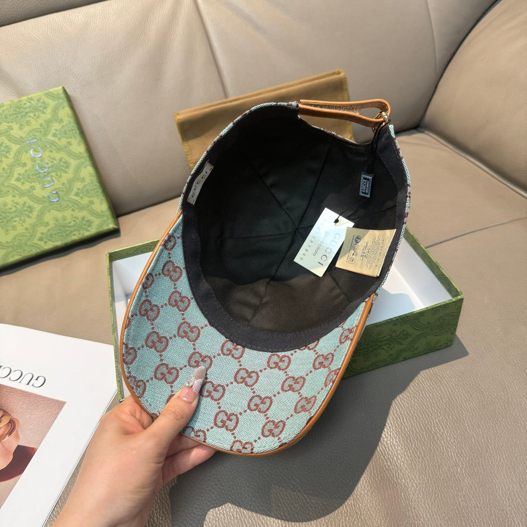 Gucci cap with light blue GG monogram fabric and black inner panel