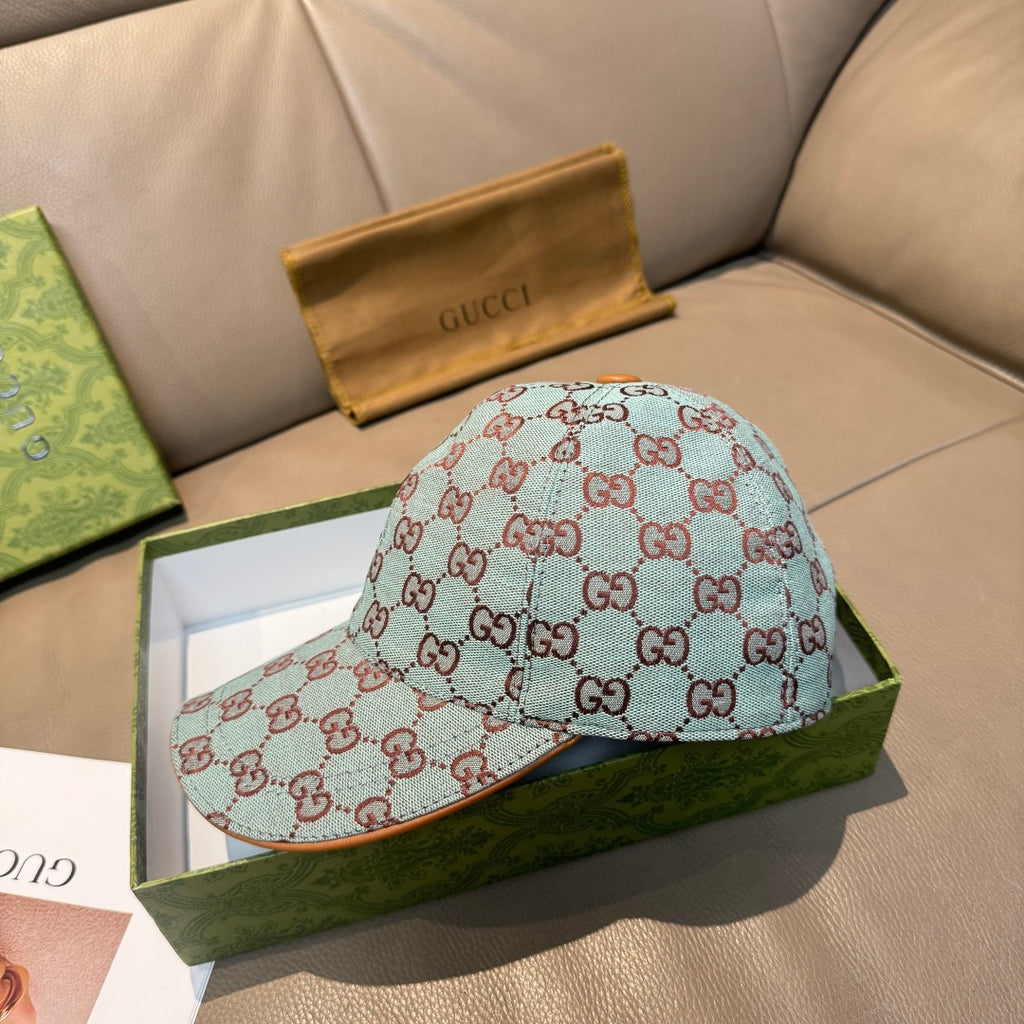 Gucci cap with light blue GG monogram print and side profile with orange button