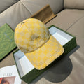 Gucci GG-pattern baseball cap in yellow with curved brim and stitched crown