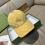 Gucci GG-pattern baseball cap in yellow with curved brim and stitched crown