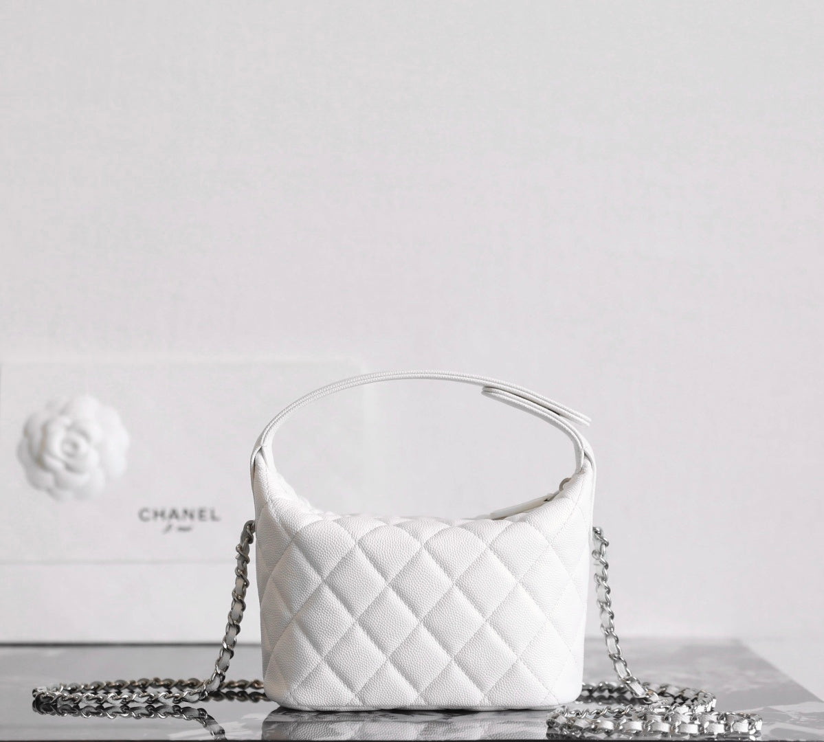 Chanel white quilted mini bag with round top handle and chain strap