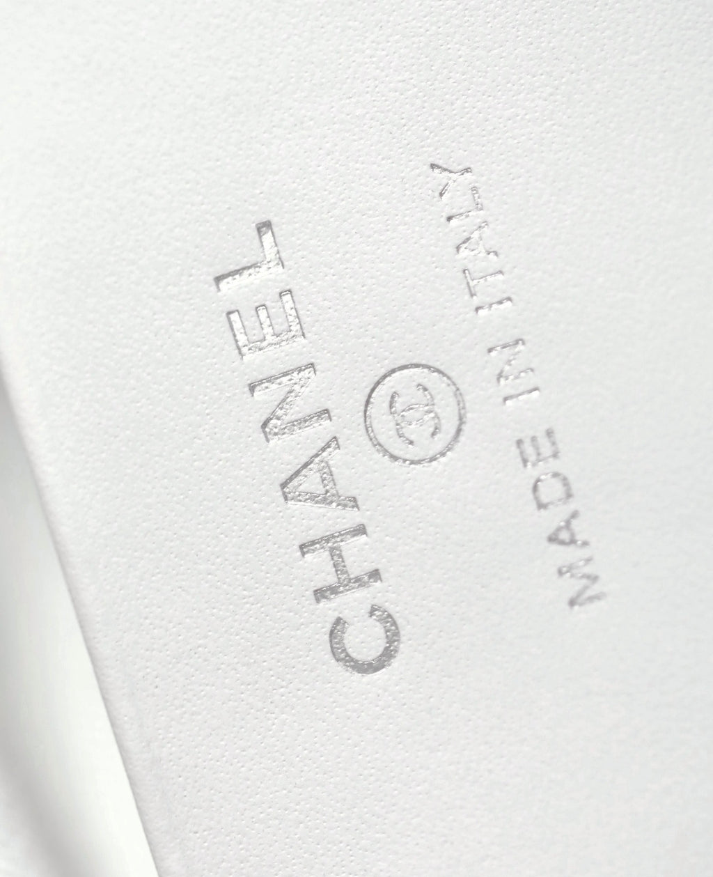 Chanel debossed logo on white leather interior