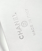 Chanel debossed logo on white leather interior