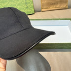 Black baseball cap brim with textured fabric and stitched edge