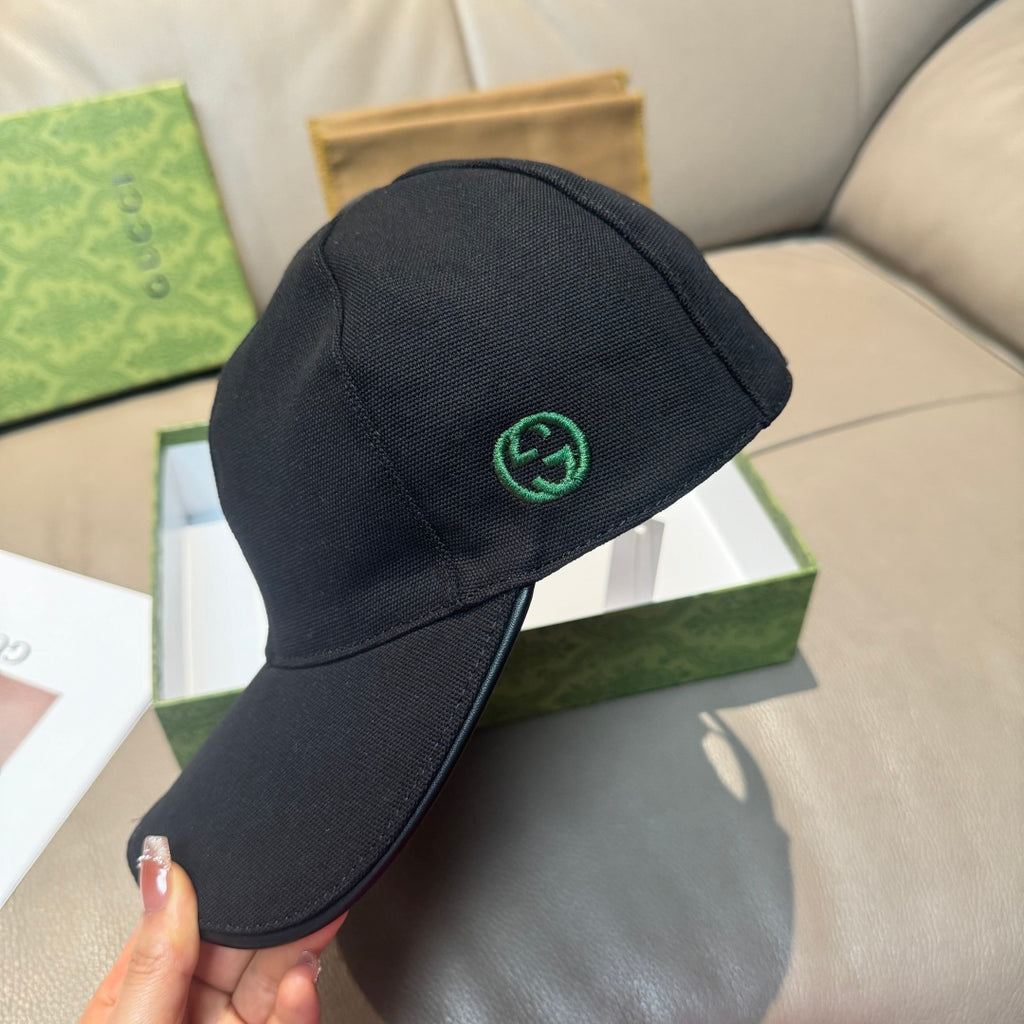 Black baseball cap with green GG logo embroidery on side