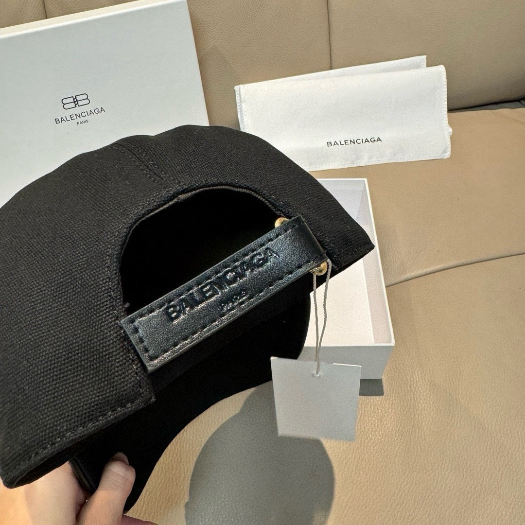 Balenciaga black baseball cap with adjustable leather strap and BALENCIAGA detail