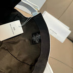 Black cap with hanging tag and adjustable strap detail
