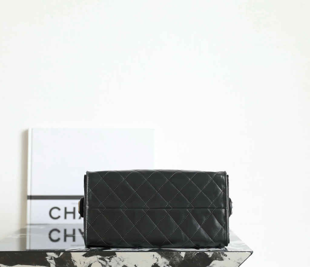 Chanel bag interior view showing dark lining and zipper opening with gold hardware