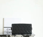 Chanel bag interior view showing dark lining and zipper opening with gold hardware