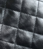 Chanel quilted leather panel with stitched diamond pattern in dark tone