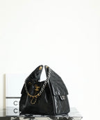 Chanel quilted leather bag with gold chain shoulder strap and small front flap