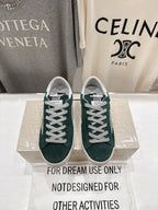 Pair of dark green suede Golden Goose sneakers with white lace-up front and rubber sole