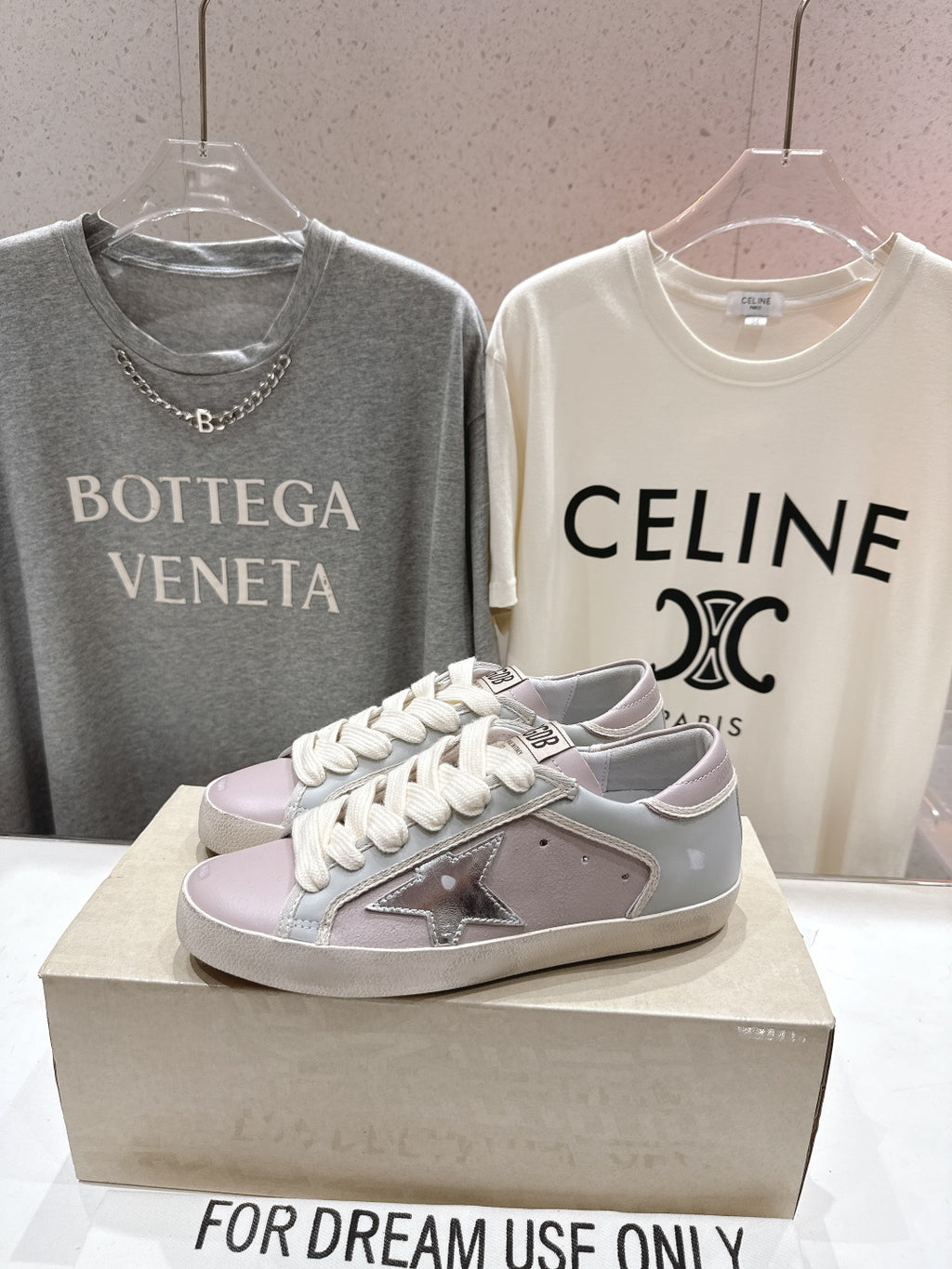 Lilac and white lace-up sneakers with star detail, single shoe on display