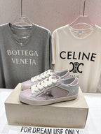 Lilac and white lace-up sneakers with star detail, single shoe on display