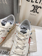 Close-up of two white sneakers from front, showing lace-up and side logo patch