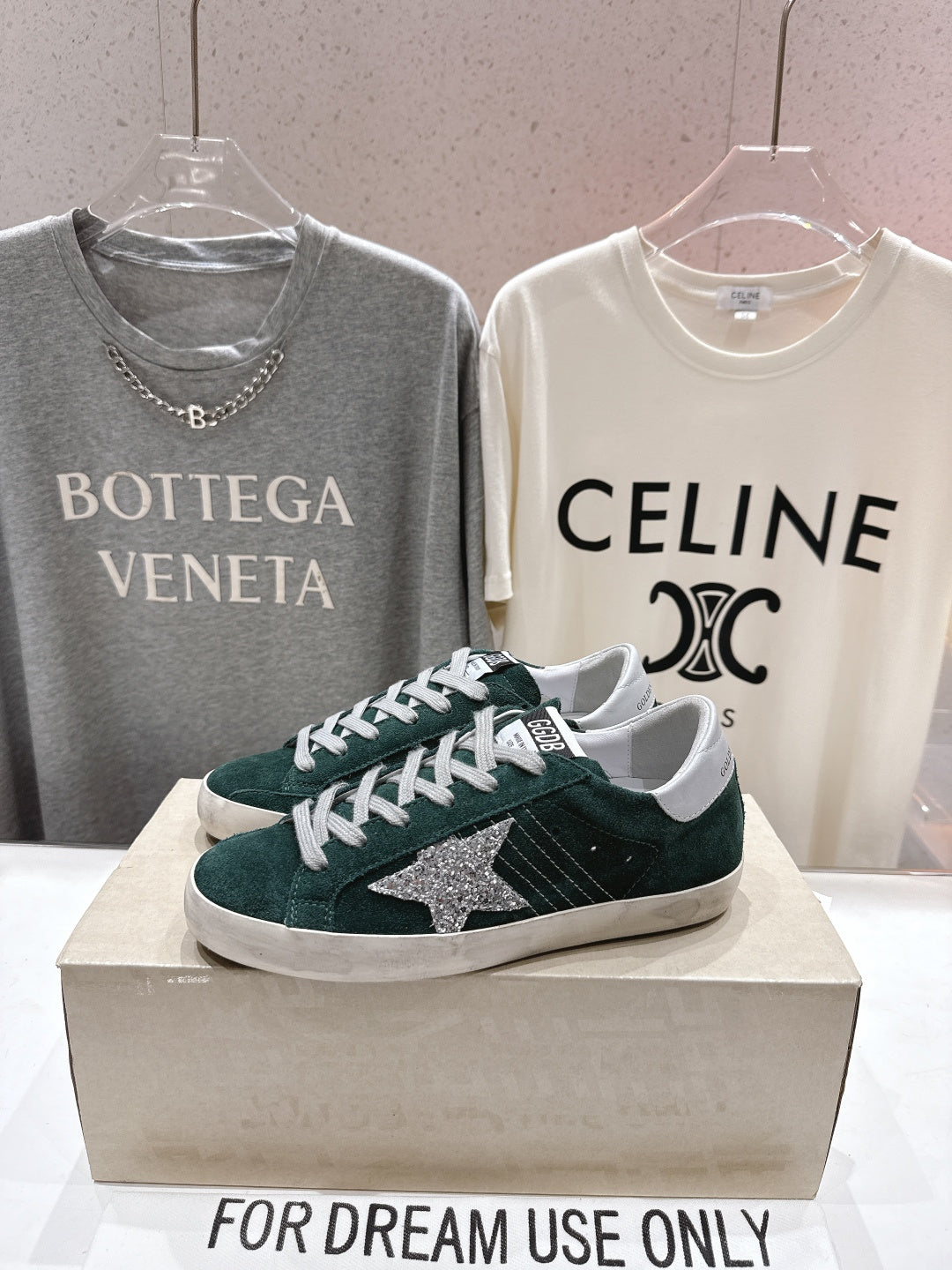 Golden Goose low-top sneakers in dark green suede with white laces and silver star detail