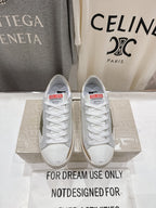 Golden Goose luxury sneakers: white with gold heel tab and green star detail