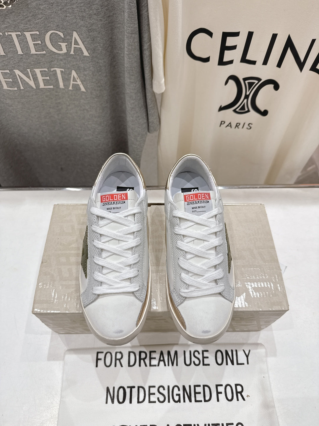 Golden Goose luxury sneakers: white with gold heel tab and green star detail