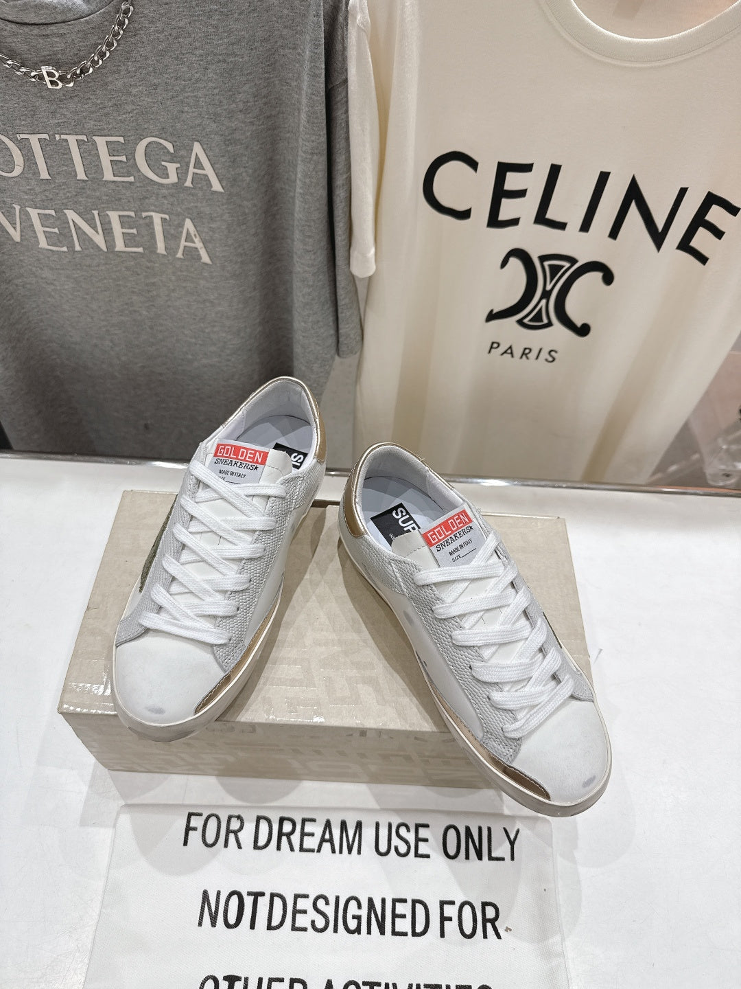 Golden Goose luxury sneakers: white with gold heel tab and green star side patch