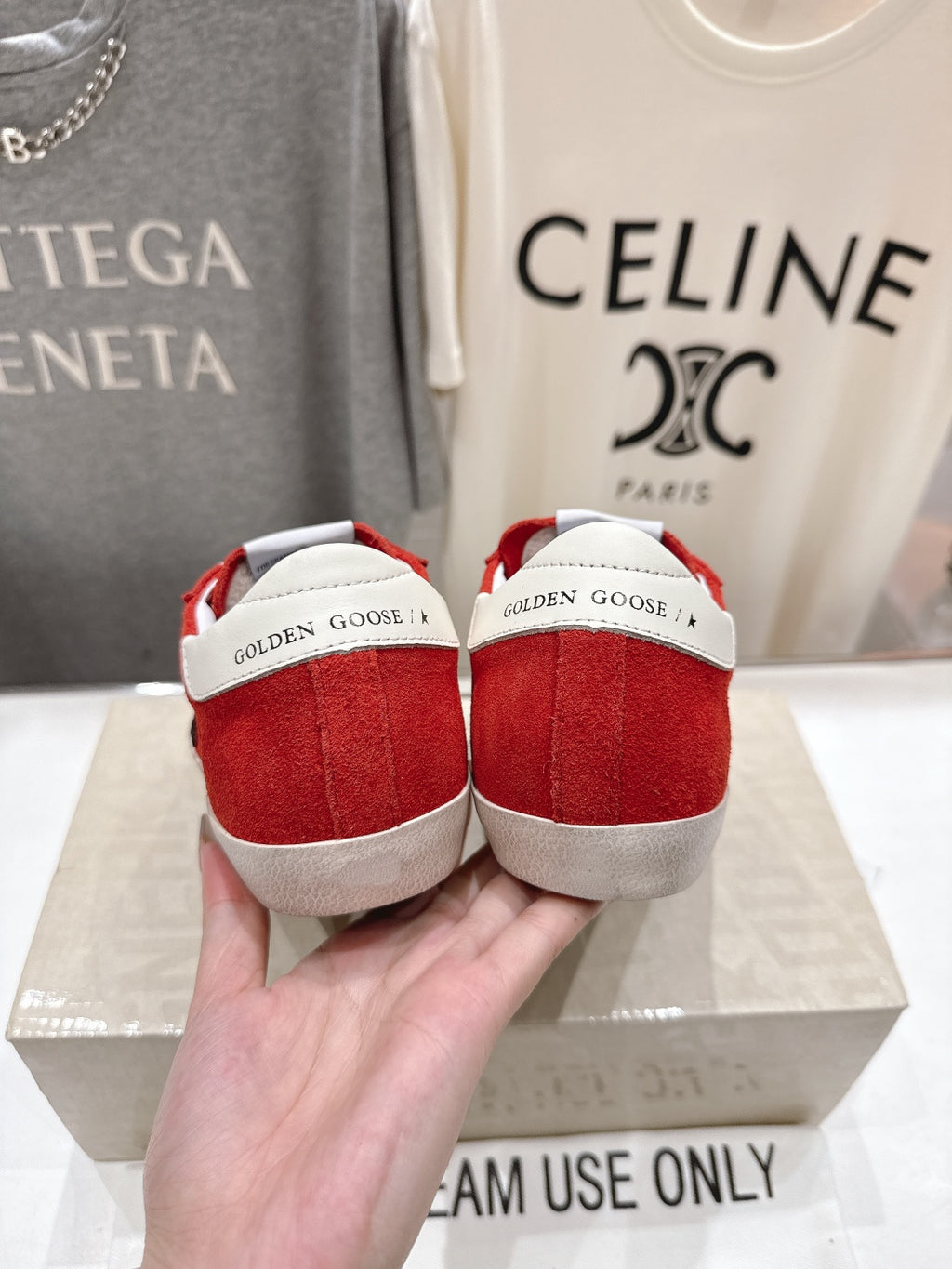 Golden Goose red sneakers back view with white heel panels and white rubber sole