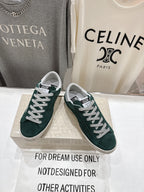 Dark green suede Golden Goose sneakers with white laces and thick white rubber sole