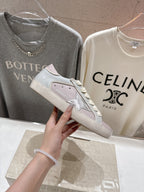 Lilac and white lace-up sneakers, close-up side with star detail and textured upper