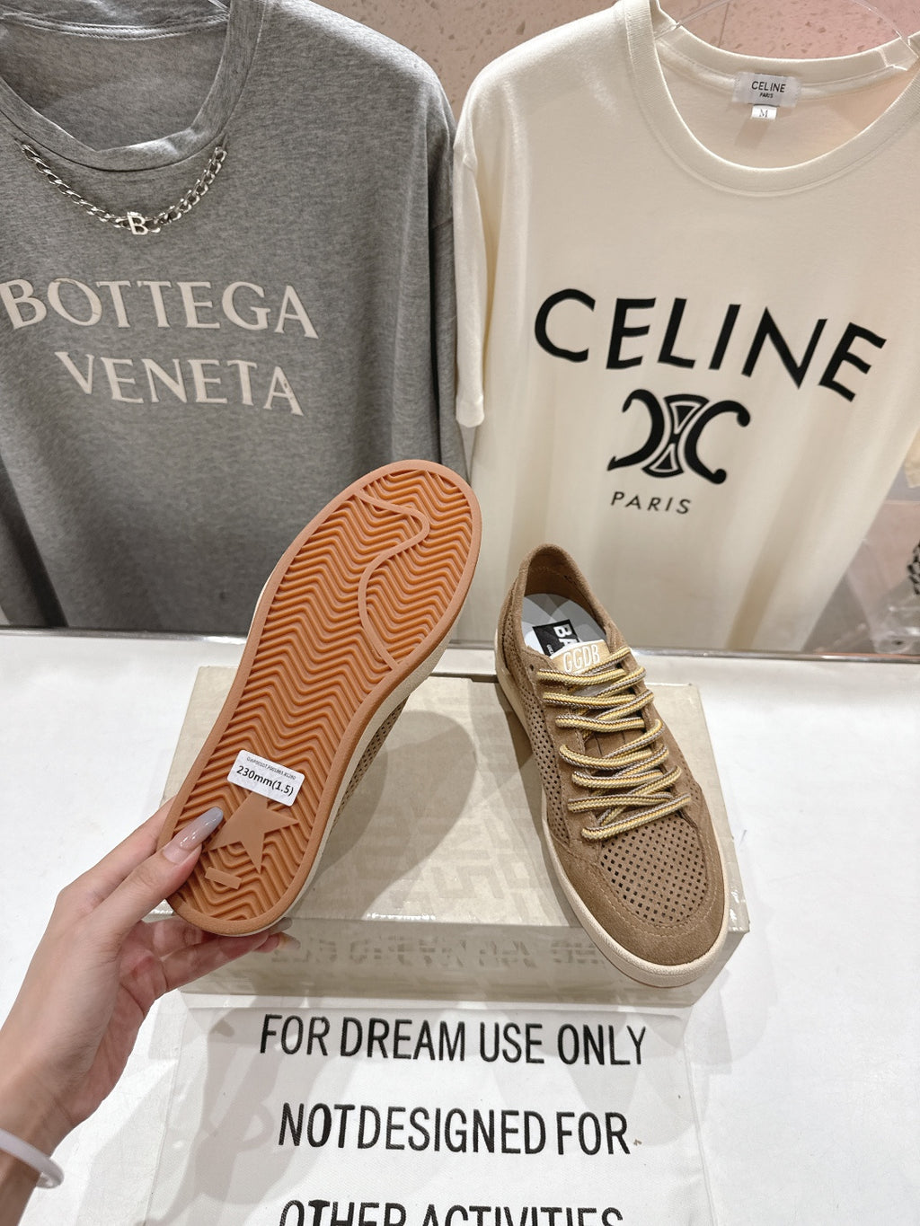 Tan sneaker outsole with textured traction pattern, white sole edge