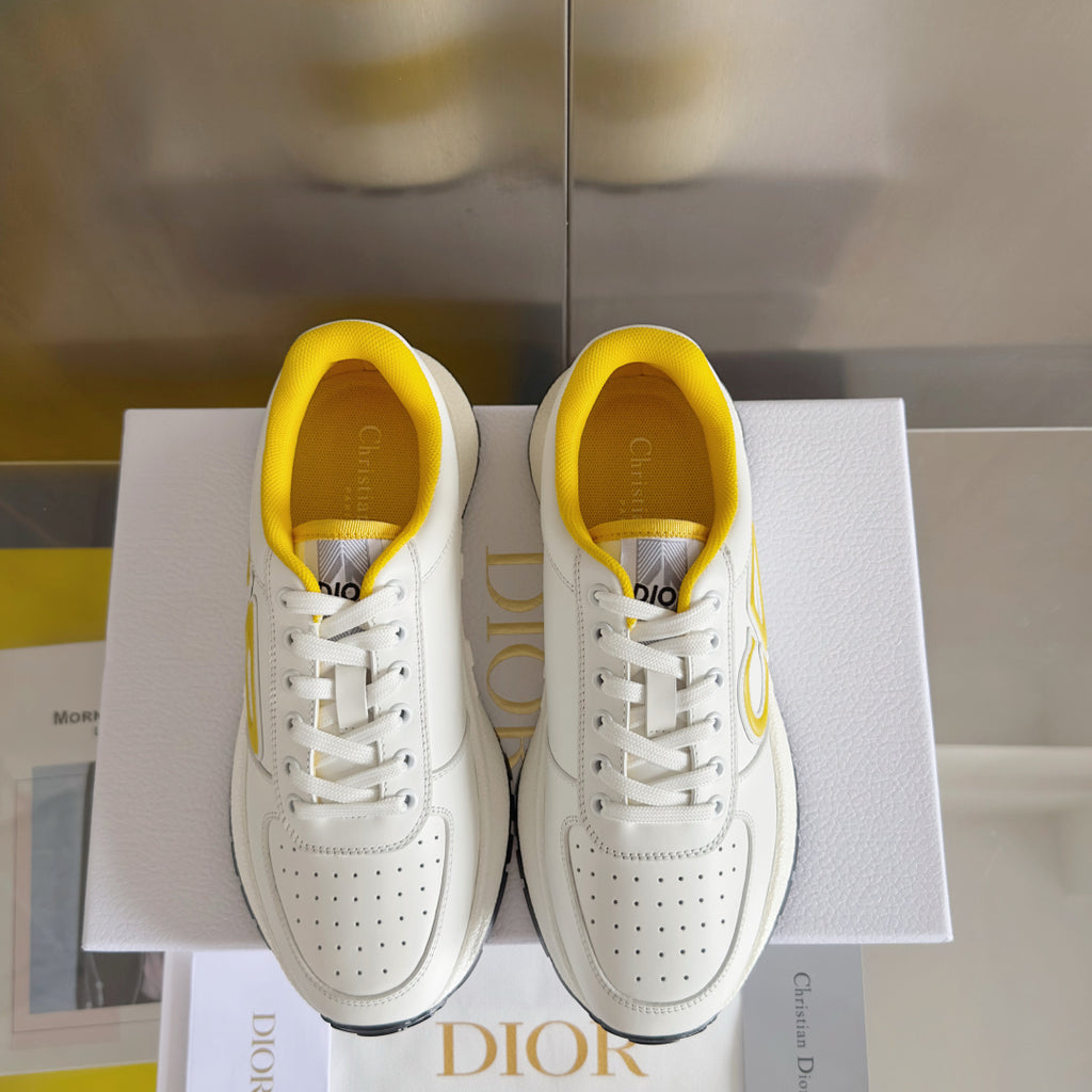 Dior unisex sneakers pair on box, white with yellow interiors and lace-up