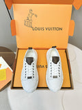 White lace-up sneakers with dark heel tabs and chunky rubber sole in a box