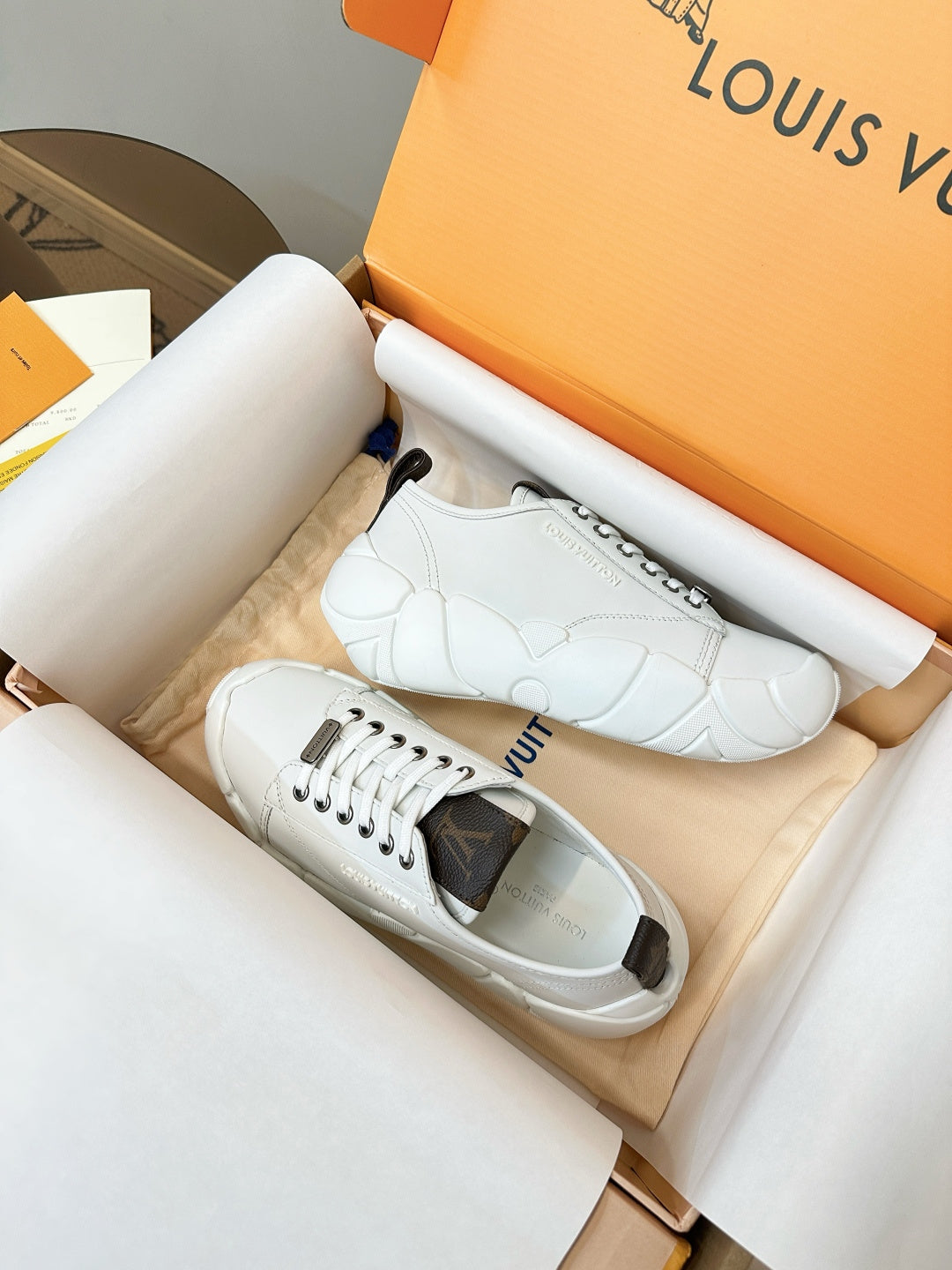 White low-top sneakers, lace-up with side logo detail