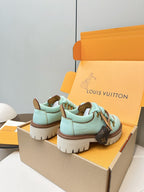 Louis Vuitton light blue sneakers with brown heel tab and monogram side patch