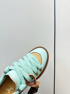 Louis Vuitton light blue sneaker with textured laces and gold lace hardware
