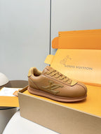 Tan lace-up low-top sneaker with LV side logo and pinkish rubber sole